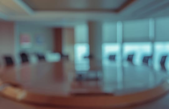 Blur image of empty boardroom with window cityscape background. Business concept