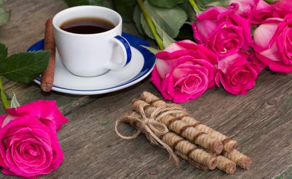 still life bouquet of roses, cup of black coffee, linking of cookies and one rose, subject beautiful flowers and drinks, greeting card