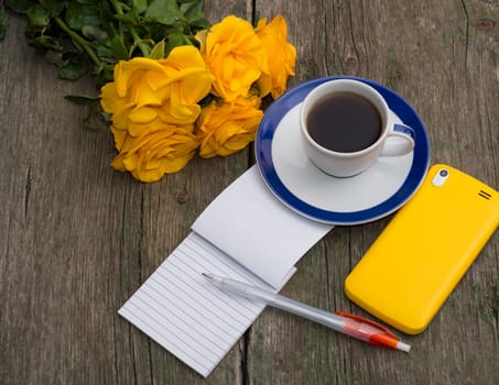 coffee still life yellow roses, phone and notebook, top view, subject beautiful flowers and drinks, greeting card
