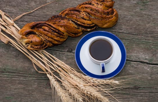 coffee still life, boluchka with a linking of wheat. subject food and drinks