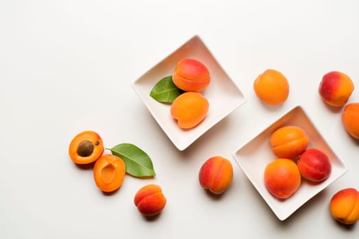 Fresh apricot fruits on white background close up