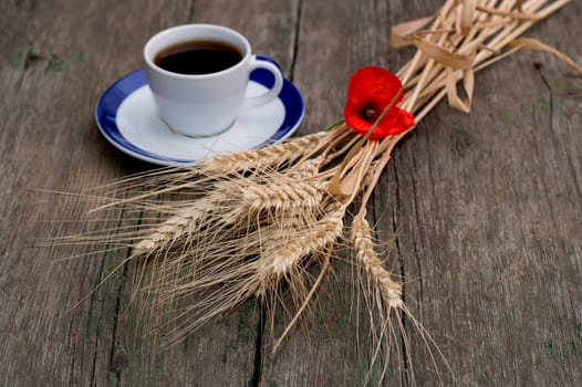 ears of wheat and coffee on a saucer, a still life, a subject drinks and products
