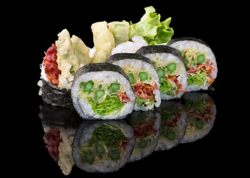Sushi set over black background