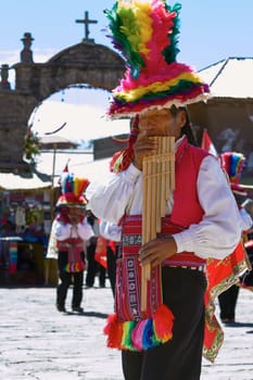 TAQUILE, PERU - JULY 29, 2012: Musicians and Dancers During a Festival on Taquile Island at Lake Titicaca in Puno Peru.