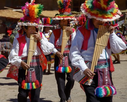TAQUILE, PERU - JULY 29, 2012: Musicians and Dancers During a Festival on Taquile Island at Lake Titicaca in Puno Peru.