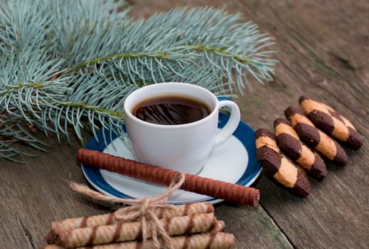 coffee, fir-tree branch and two groups of beautiful cookies, subject holidays Christmas and New Year