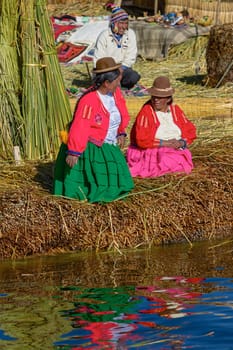UROS, PERU - JULY 29, 2012: Family Living at Floating Islands of Uros at Lake Titicaca in Peru and Bolivia
