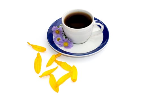 coffee on a saucer, decorated with three blue florets and petals, a subject drinks and flowers