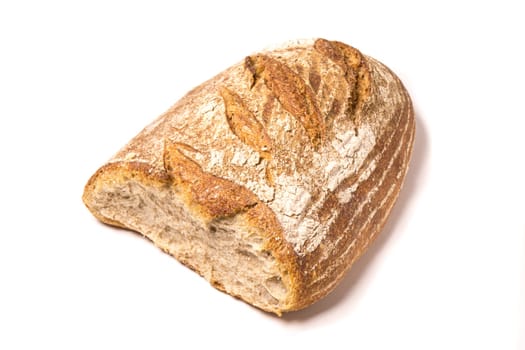 Loaf of fresh baked Organic whole wheat bread, isolated on white
