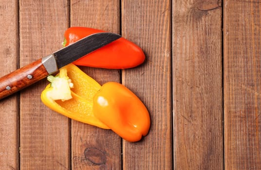Small bell peppers in red and orange