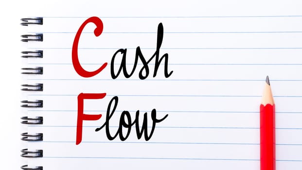 CF Cash Flow written on notebook page with red pencil on the right