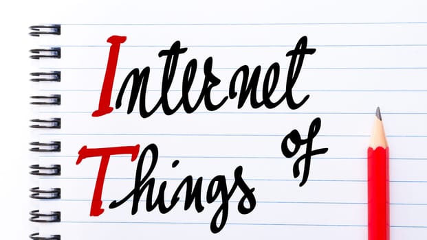 IT Internet Of Things written on notebook page with red pencil on the right
