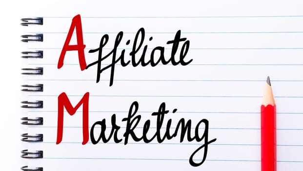 AM Affiliate Marketing written on notebook page with red pencil on the right