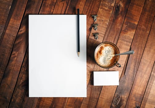 Blank branding mock-up. Blank paperwork template. Blank stationery set. Responsive design mockup on vintage wooden background. Top view.