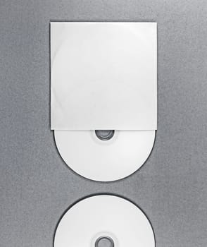 Photo of blank CD on gray background. Template for design presentations and portfolios. Mockup for branding identity.
