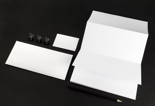 Corporate identity template on black background. Photo of blank stationery. For design presentations and portfolios. Mock-up for branding identity.