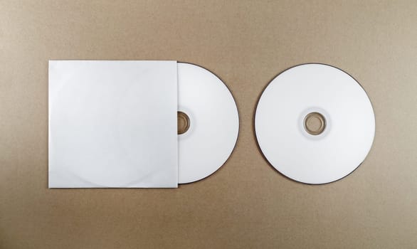 Blank compact disk on a table. Template for branding identity for designers. Top view.