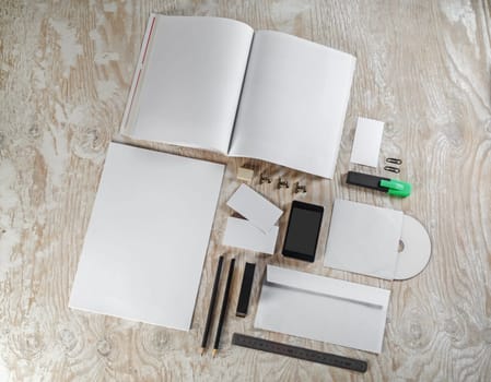 Blank corporate identity template on light wooden background. Mock-up for graphic designers portfolios.