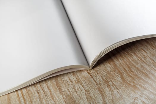 Photo. Blank opened book on wooden background.