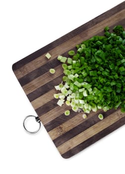 Green chopped onions on a cutting board. Clipping path.