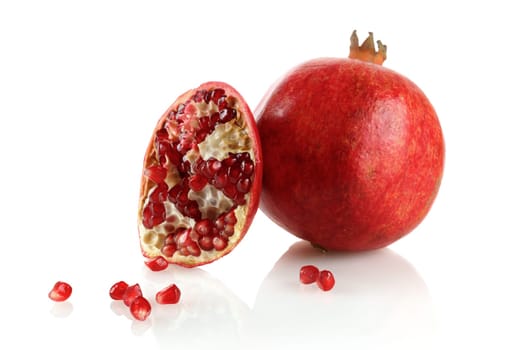 Ripe appetizing Juicy pomegranate on a white background.