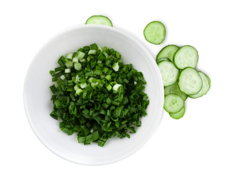 Cucumbers and green onions sliced for salad. White background. Clipping path.