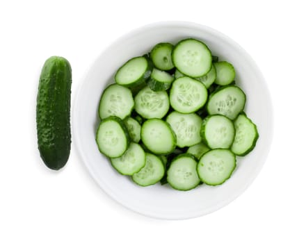 Fresh cucumbers, cut into slices on a white plate. Clipping path.