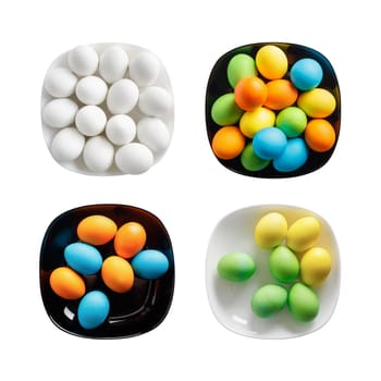 Four square plates with painted colorful Easter eggs. Colored eggs on a black and white dishes. Isolated on white background. Top view.