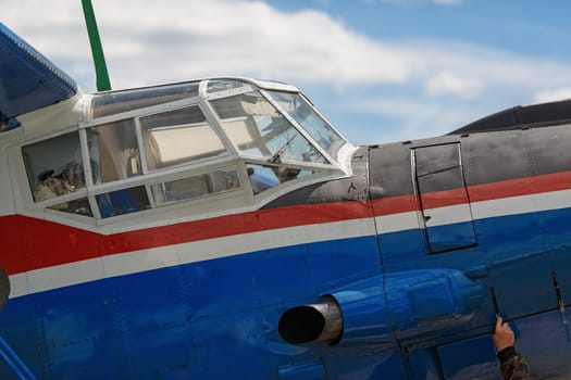 Cockpit old blue airplane close up. Large fragment.