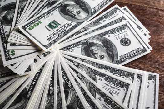 Many 100 dollar bills. Money as background.