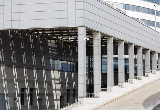 Modern business industrial architecture. Modern industrial building with a colonnade.