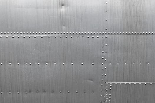 Abstract metallic background. Silver metal texture with rivets.