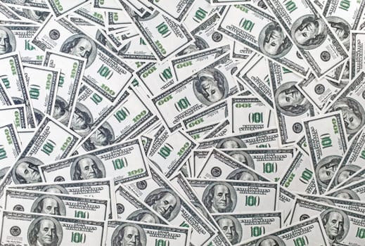 Background from a variety of one hundred dollar bills. Many dollars. Money background. Fake money.