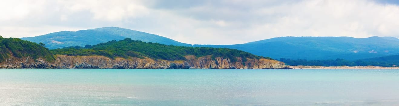 Seascape and mountains. Panoramic shot.