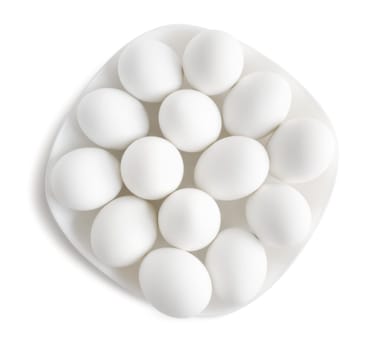 White eggs on a white plate . Clipping path.