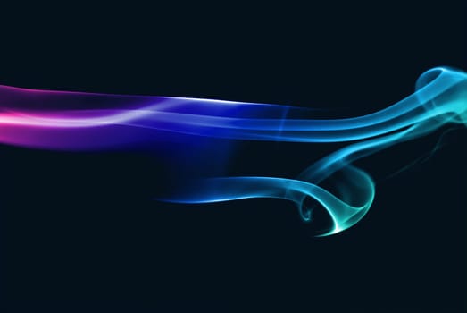 Abstract bright colored smoke on a dark background.