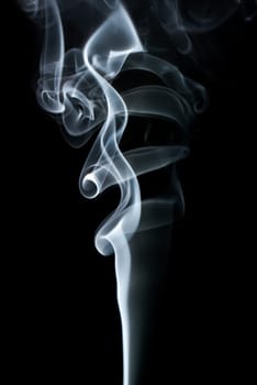 Abstract light smoke on a dark background. Studio shot.