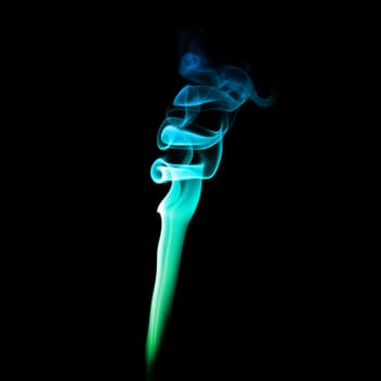 Abstract bright colored smoke on a dark background.