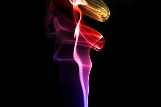 Abstract beautiful colorful smoke on black background.