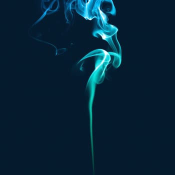 Blue smoke. Abstract bright colored smoke on a dark background.