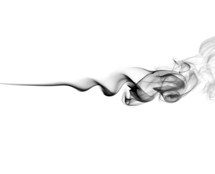 Abstract black smoke swirls on white background. Photo.