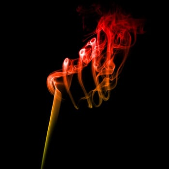 Abstract bright colored red smoke on a dark background.