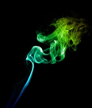 Abstract bright colored green smoke on a dark background.