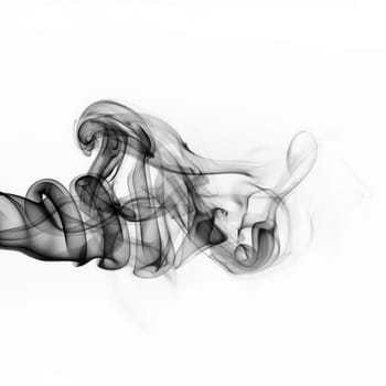 Abstract black smoke swirls over white background