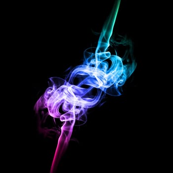 Abstract bright colored smoke on a dark background.