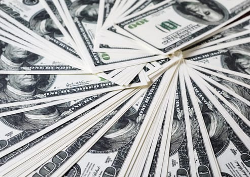 Money as background. One hundred dollars heap. Selective focus.