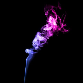 Abstract bright colored smoke on a dark background.