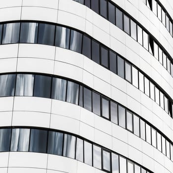Fragment of modern architecture. Close-up view of the modern building. Modern business industrial architecture.
