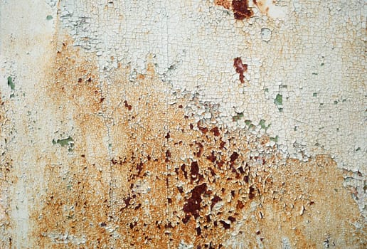 Abstract vintage texture. Old peeling paint with cracks and rust spots. Grunge background.