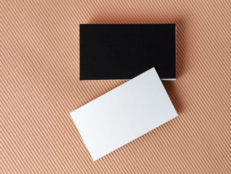 Black and white business cards on color background. Mock-up for branding identity. Isolated with clipping path. Top view.